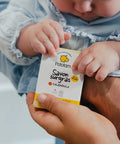 Savon surgras au calendula pour bébé de la marque Pototam, pour bains et douche, adapté dès la naissance, avec emballage blanc et vert.