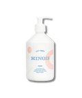 Lait pour le corps Minois Paris, hydratant, visage et corps, bouteille blanche avec pompe, texture douce et soyeuse visible.
