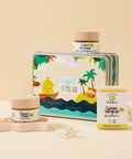 Coffret Pototam Trésors l'Essentiel Soin Bébé dès la naissance, comprenant plusieurs produits de soin pour bébé dans une boîte élégante.